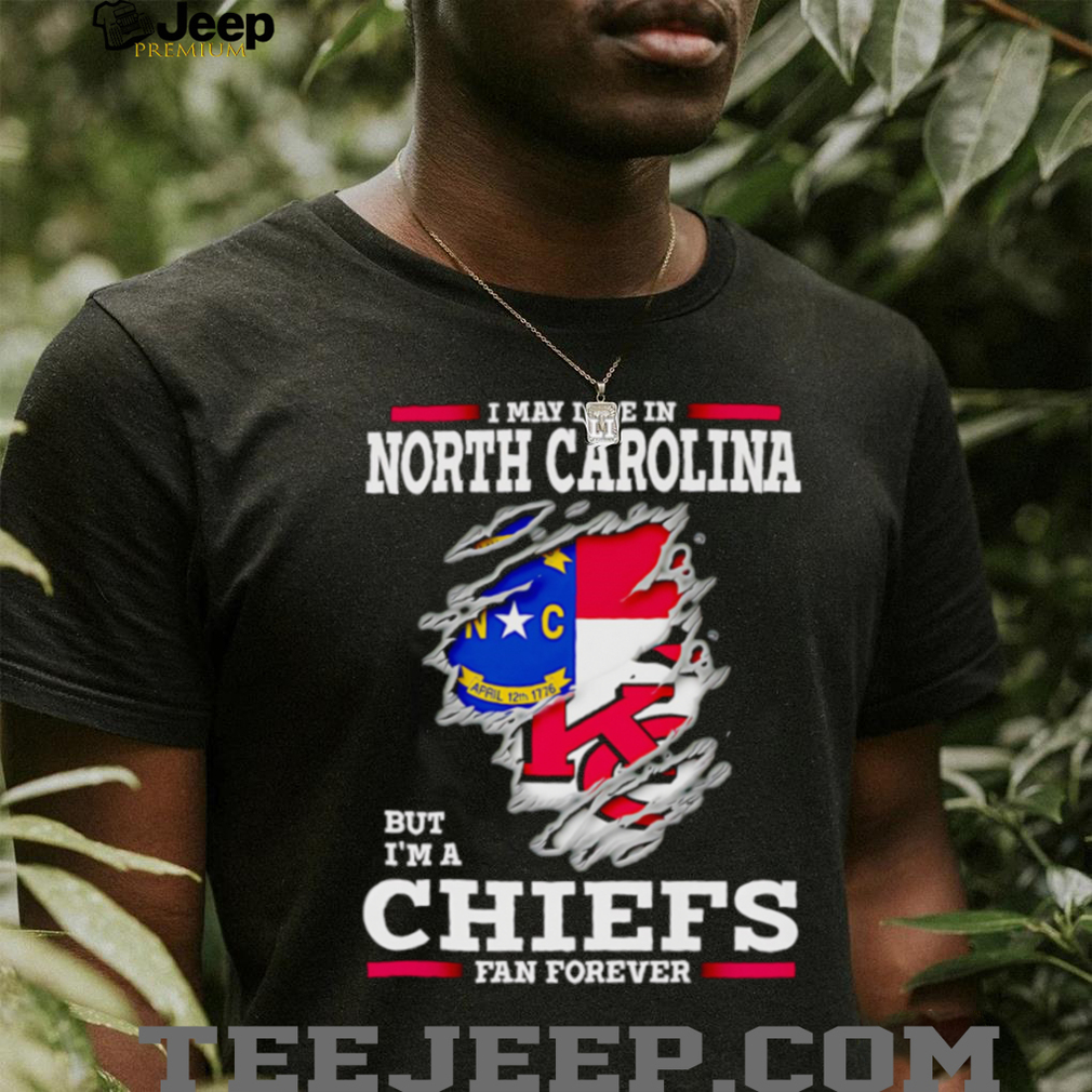 Person proudly wearing the Kansas City Chiefs fan shirt