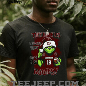 Texas A&M Aggies Custom Name Grinch Christmas Shirt – Personalized NCAA Football Tee – Quote Holiday Gift “They Hate Us Because They Ain’t Us”