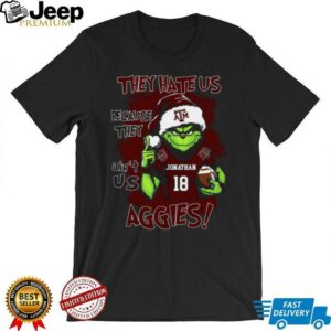 Texas A&M Aggies Custom Name Grinch Christmas Shirt – Personalized NCAA Football Tee – Quote Holiday Gift “They Hate Us Because They Ain’t Us”
