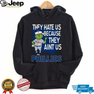 Custom Philadelphia Phillies Grinch Christmas Tee, Funny Santa Baseball Shirt with Quote They Hate Us Ain’t Us, MLB Fan Gift