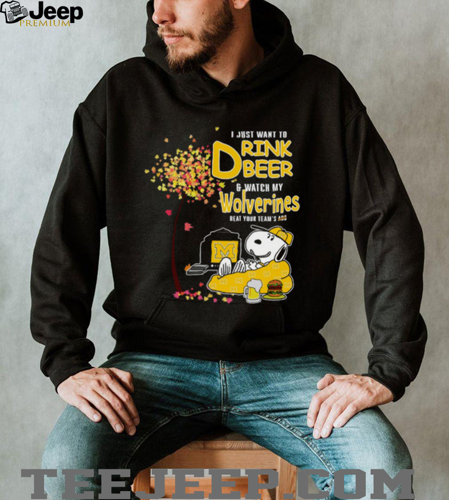 Person enthusiastically wearing Michigan Wolverines beer and football T Shirt